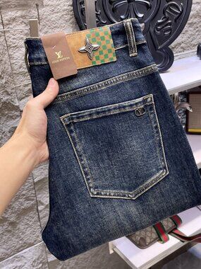 The LV jeans are too big for the man to wear.